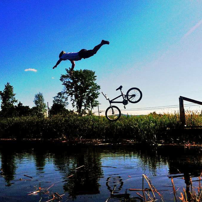 Mad Marathon Fundraiser Nate jumping in the pond