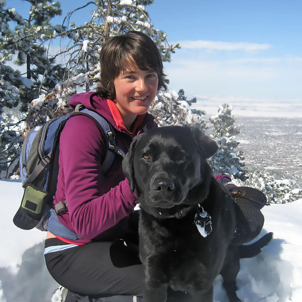 Hannah winter hiking with her dog